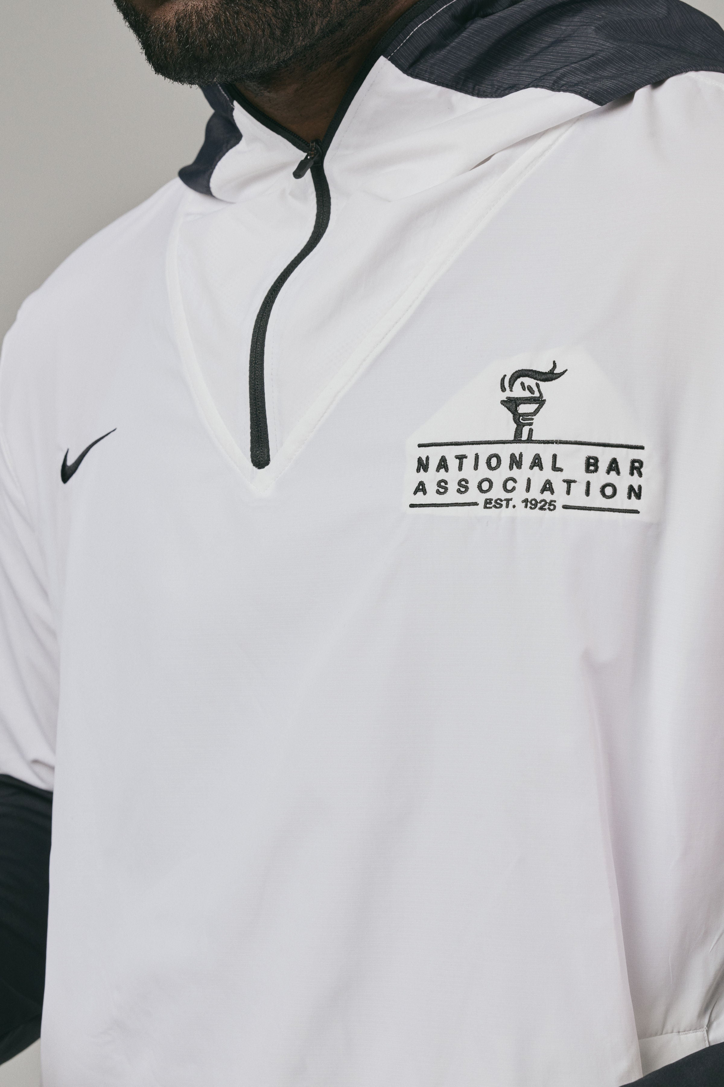 White hoodie with black accents and 'National Bar Association' logo on a grey background