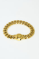 Gold chain bracelet on a white background