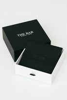 Black box with 'The Bar' branding on a white background